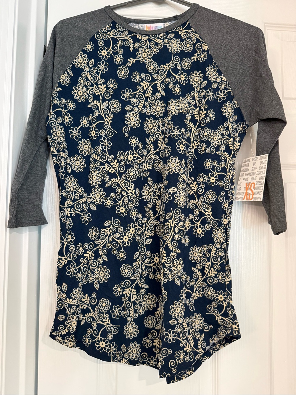 LuLaRoe Randy Navy and Cream Floral Raglan Top with Gray Sleeves